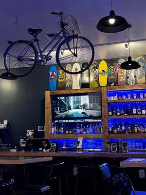 Part of the decor inside with bicycles on the ceiling and snowboards along the wall