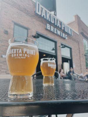 Kettle to the Metal Lemon (left) and strawberry (right) in front of the Dakota Point Brewing sign