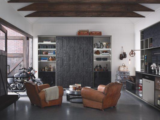 Custom-designer cabinets, drawers, shelves, and specialty racks create a purposeful garage for efficiently storing tools.