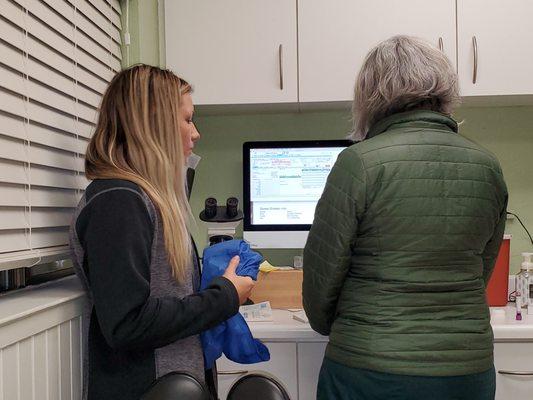 Dr. Wendy and assistant checking blood panel