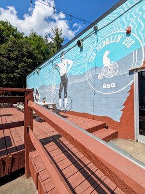 Welcome Mural and outdoor patio seating