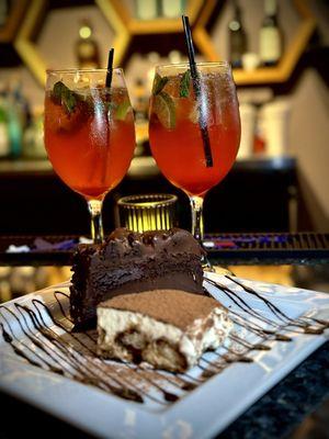 Twisted Mojito Muddled mint, lime and orange. Strawberry puree topped with patron tequila, Victoria champagne, and a splash of sprite.