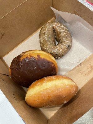 A blueberry Boston cream and strawberry glazed