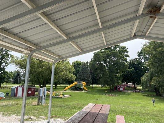 Picnic tables near bathroom. Nicely shaded. One of the playgrounds