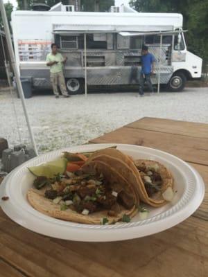 Two carne asada tacos and the truck.