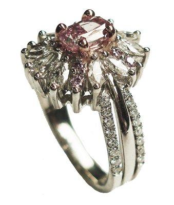 Pink diamond and white diamond set in platinum ladies ring.