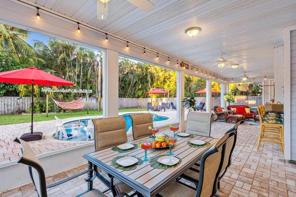 Cape Calypso: Luxe Hobe Sound FL rental with heated pool, screened lanai, firepit & coastal charm. Bike to beach & unwind in style!