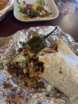 A súper burrito and an adobada taco