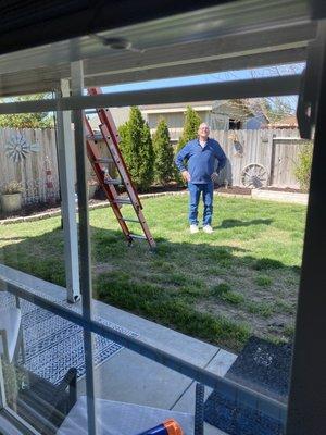 My 61 year old father waiting to help get panels down safely off the roof after one man volunteered to come take them down