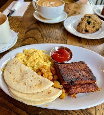 Cowboy breakfast vegan style.  Disappointing.  That's tempeh bacon, scrambled Just Eggs I think, 2 unheated grocery store-type tortillas.