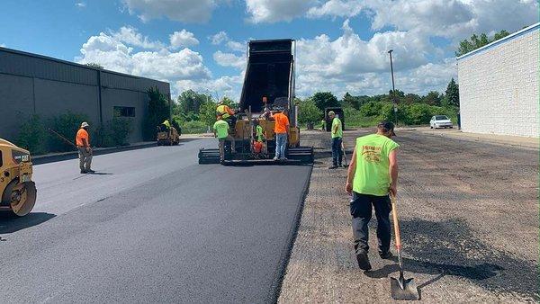 Crew Laying Asphalt Parking lot