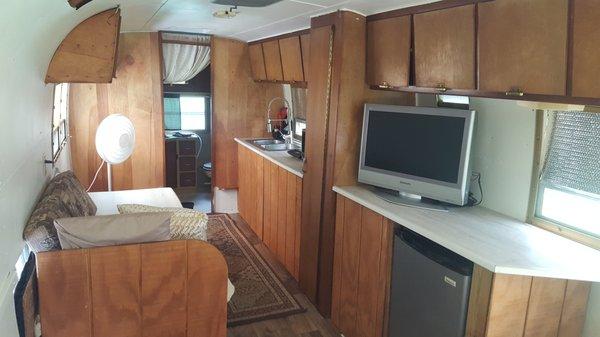 Camp in style! Vintage camper with all amenities, including queen size bed, WiFi, TV, cooking, private shower and bath.