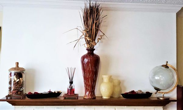 Fireplace mantle within a home office