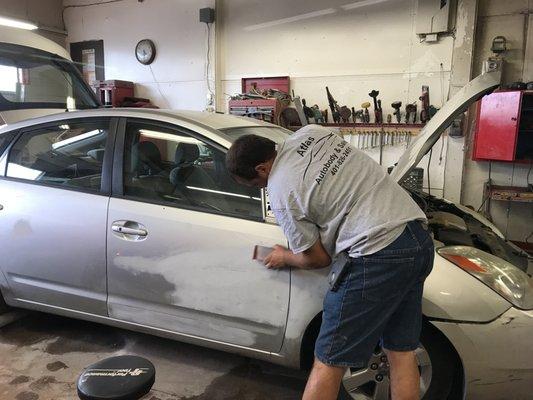 Gordon prepping car sanding the side door & fender