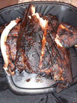 Really burnt ribs. They are more burnt in person.