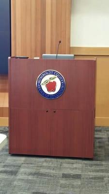 Podium with HCOE logo.