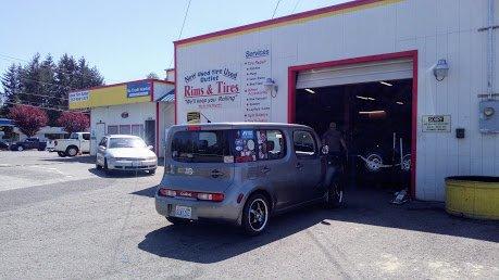 Store Front.  Installing a "new" set of 4 for customer and "new" rims.