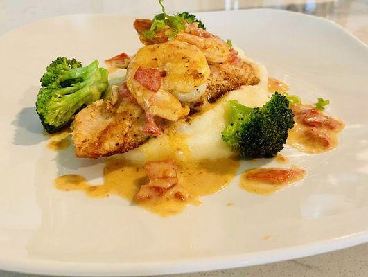 ATOS seared salmon- with mushed potato broccoli- topped with shrimp and lemon wine sauce.