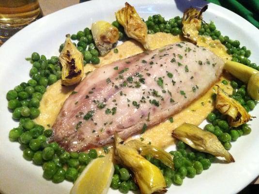 Corvina Valenciana - Baked Drumfish on lemon olive oil puree with sauteed peas and artichokes.