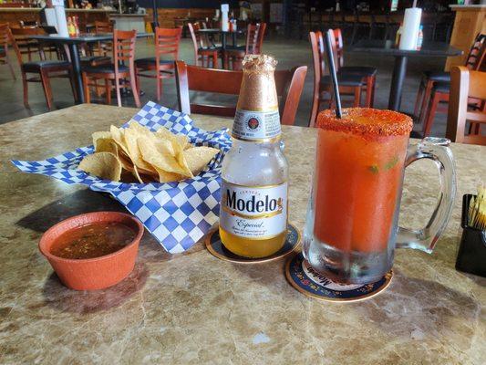 Seriously good HOMEMADE CHIPS AND SALSA, HIS michelada w modelo..yum!