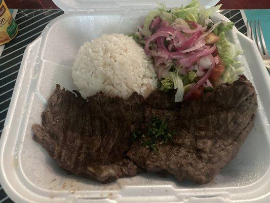 lb. Grilled Steak with 2 side orders: rice and salad.