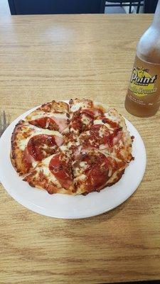 Roadkill pizza: pepperoni, sausage, Canadian bacon, and non-Canadian bacon, with barbecue sauce.