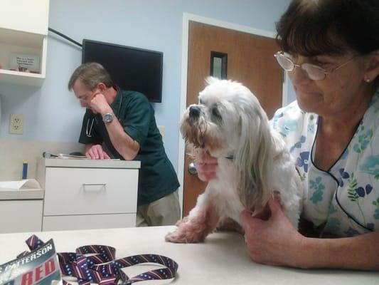 Dr. Whitley reading baby's chart.