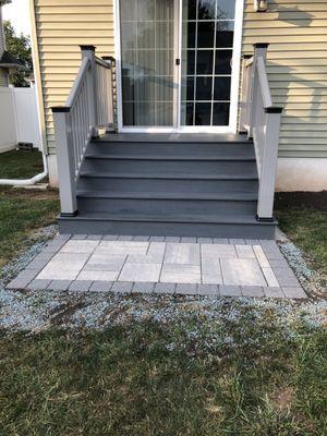 Back door trek deck and pavers patio