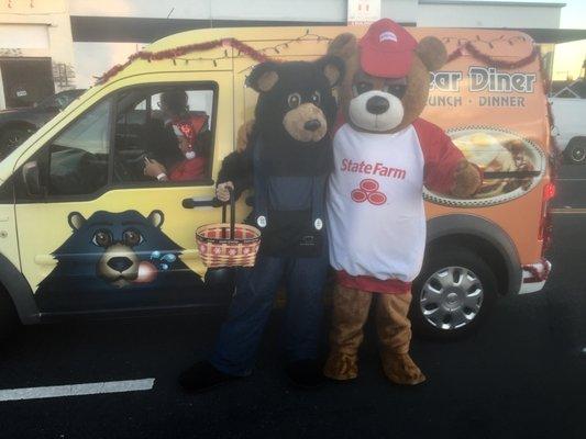 State Farm Neigh Bear visiting with other participants while waiting for the 2016 Mad Hatter Parade to begin.