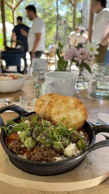 Shakshouka , eggs , plant chorizo, tomato, peppers, cilantro, avocado, queso fresco, colombian arepas. Huevitos en purgatorio !