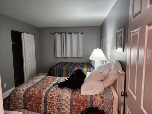 Back bedroom in 103. Strange window though showing a view of the hallway.