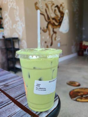 Tasty iced matcha latte with oat milk