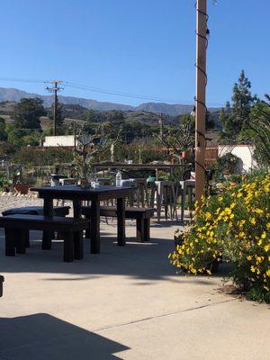 Communal table and stools. And square cocktail tables.