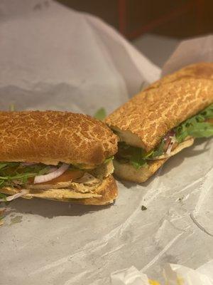 Turkey, cheese, pesto, garlic aioli, arugula, onions, toms, yum!!