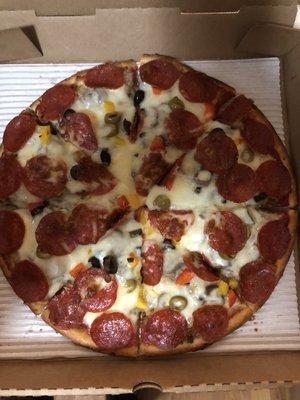 Deluxe pizza, loaded with toppings.