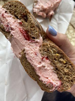 Cinnamon raisin bagel with strawberry cream cheese