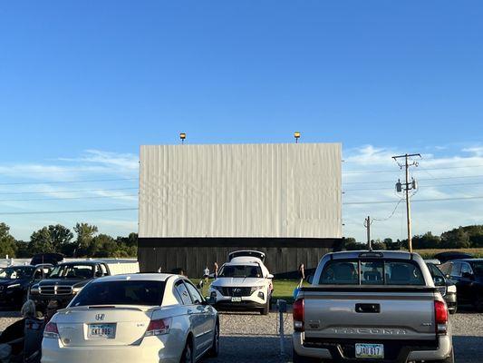 Valle Drive-In screen - tailgating prior to showtime at dusk.