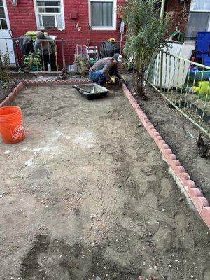 Whole plants removing and adding a scallops brick border around backyard, tamping, adding commercial  landscape fabric, adding white pebbles