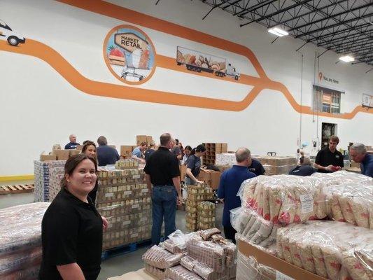 Helping our friends from NTT Data volunteer at the North Texas Food Bank