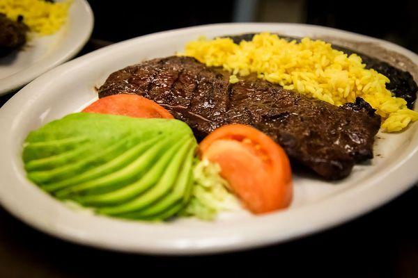 Carne Asada at Flaco's Mexican 
' Tender Marinated Steak, Sliced Avocado, Rice and Black Beans