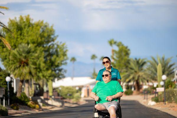 Caregiver assisting client in wheel chair