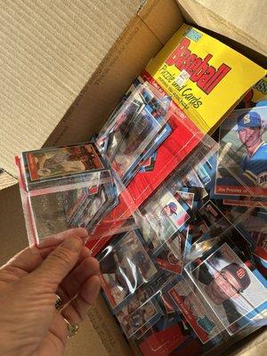 Scattered baseball cards inside shipping box