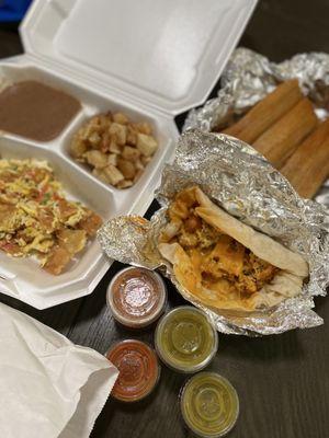 Chorizo, egg, potatoes and cheese tacos. Migas and tamales