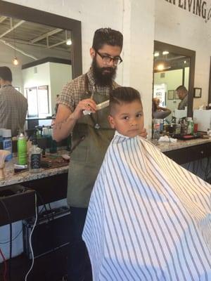 My son getting his awesome haircut