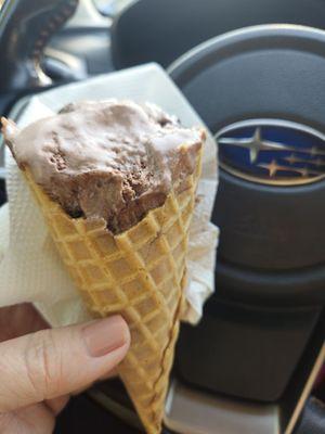 Chocolate ice cream on a waffle cone