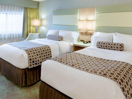 Two Double Bed Guestroom at Crowne Plaza Lansing West features 48" HDTV, Keurig coffee maker, microwave, mini refrigerator, Wi-Fi, & more