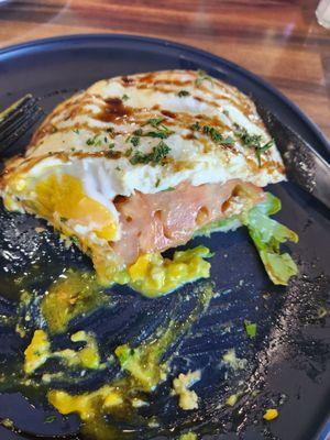 Avocado toast with egg, tomato, arugula. After I dug in.