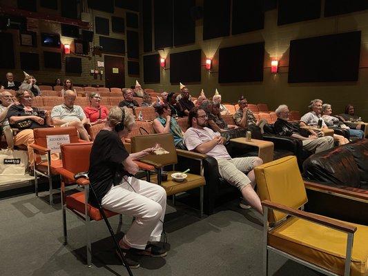 Ragtag attendees wait for an event to start