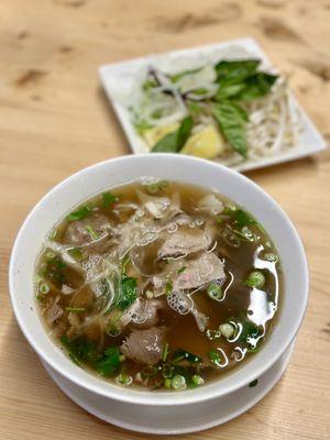 House Special Pho with rare steak, flank, brisket, tendon, and tripe