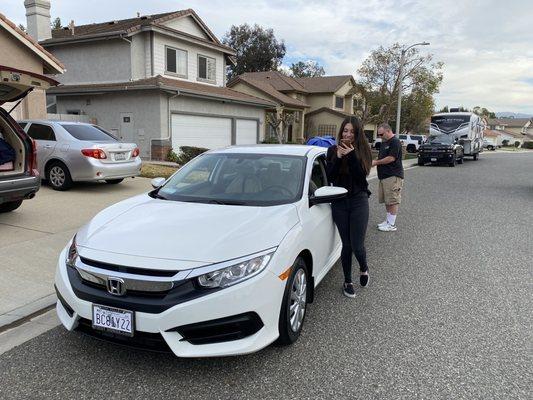 Loving her car.